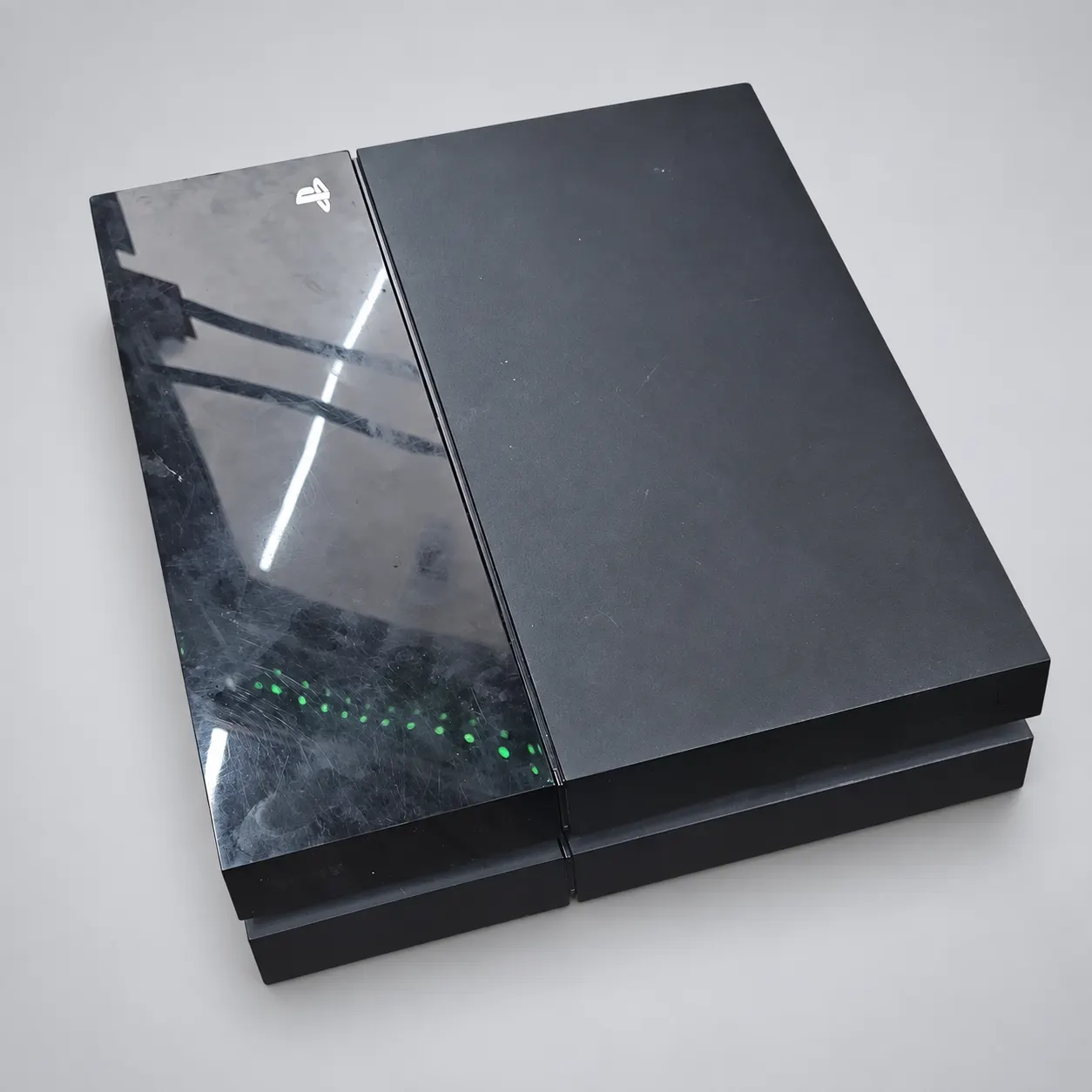 Used Sony PlayStation 4 console without controller, shown on an AI-enhanced gray background; see original photos for condition.
